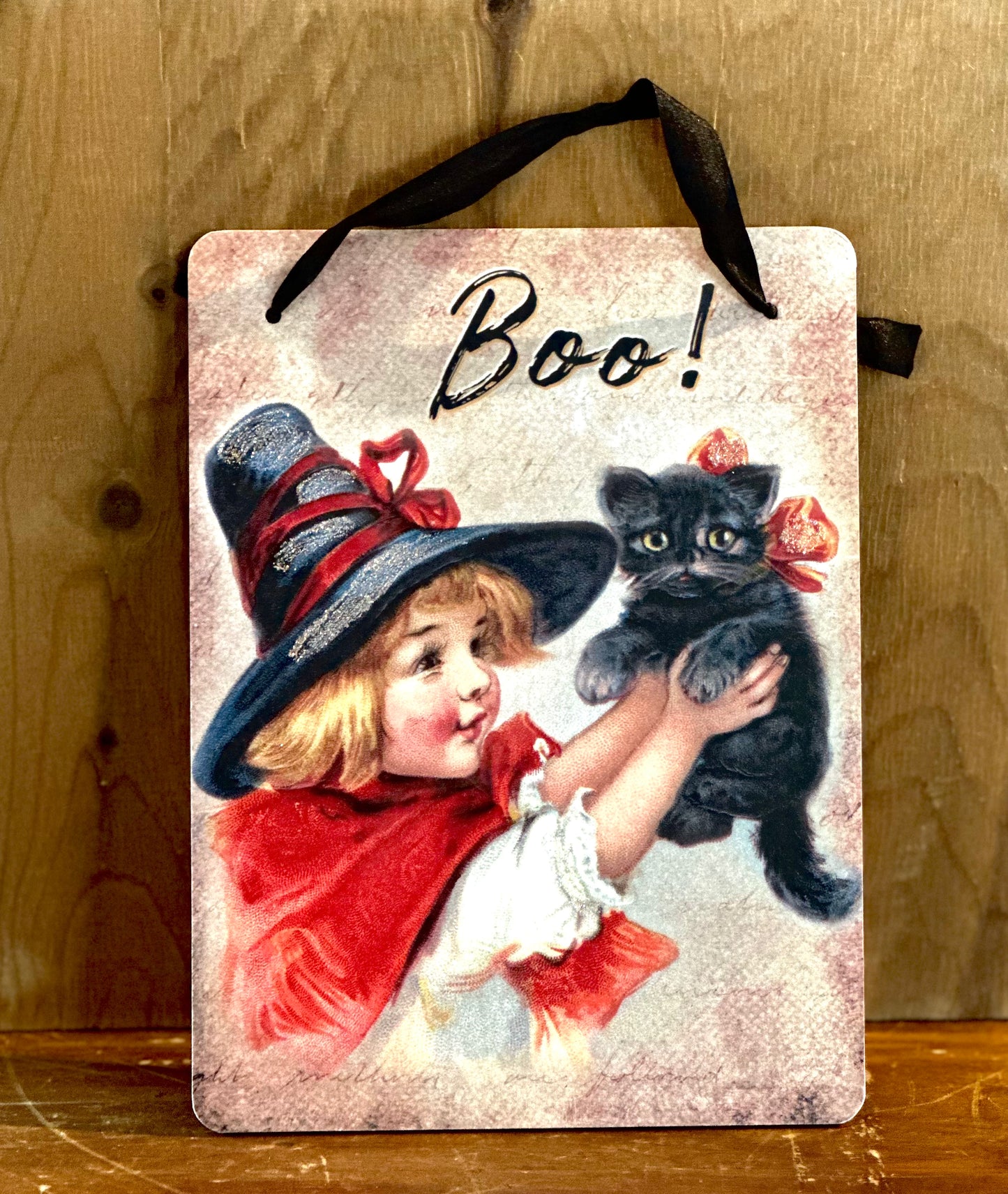 Skylt med Halloweenflicka och katt